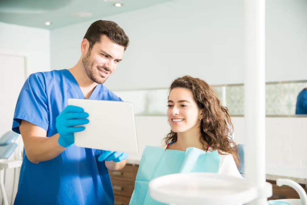 dentist explaining cdcp in leangley and dental insurance options to a patient.